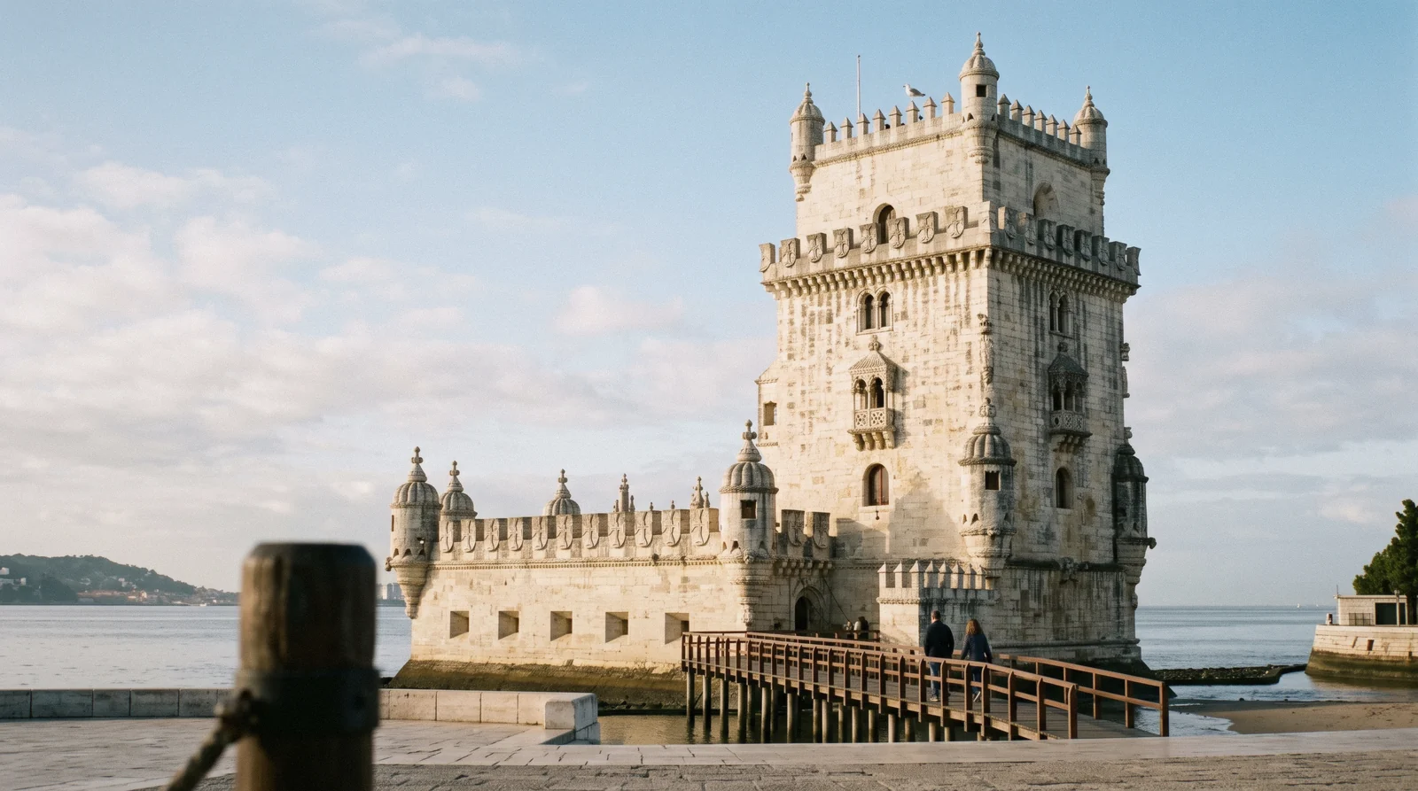 Belém Tower on its basalt outcrop in the Tagus at 08:40, the bastion and the four-storey keep in low morning light, Belém Tower Lisbon